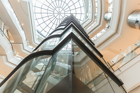 电梯直梯商场建筑天窗透明设计背景