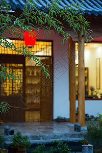 红色中式花纹黄昏时候的茶舍背景