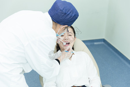 医疗美容仪器健康医疗医生给美女检查牙齿背景