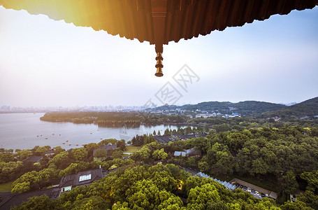 西湖美景图雷锋塔上眺望杭州西湖夕阳美景背景