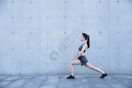 健身女素材户外运动女孩热身压腿背景