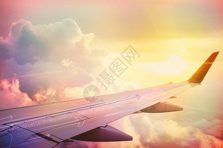 太阳下的多彩飞机机翼背景图片