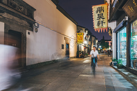 剪纸城市夜晚的杭州清河坊街背景