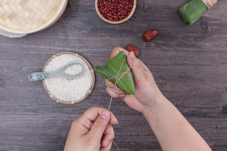 粽叶子端午节传统手工包粽子过程背景