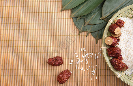 干粽叶端午节竹垫上食品背景背景