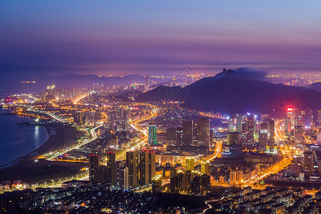 比亚迪云轨繁华的海边城市夜景背景