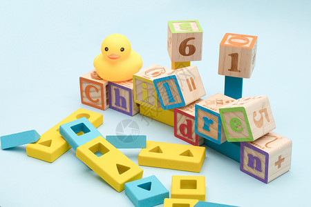黄色的鸭子玩具儿童节小黄鸭积木海报素材背景