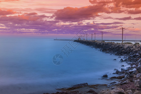 但尼丁日落海边背景