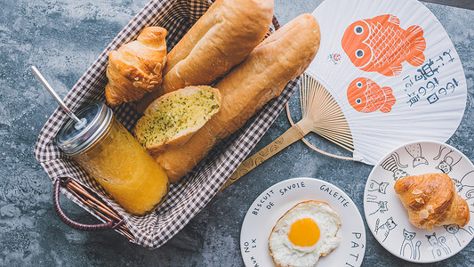面包煎蛋早餐西餐早餐面包橙汁水果背景