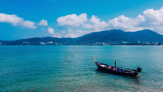 海边树叶蓝天白云小船度假背景