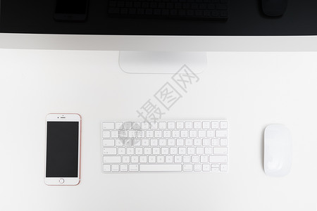 黑白电话摆放整齐简洁的苹果电脑一体机背景