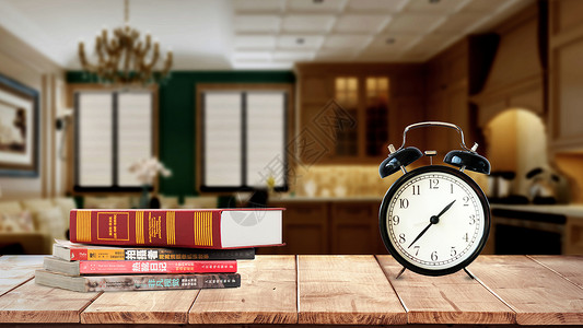 张开的书老旧书桌上的钟表和书设计图片