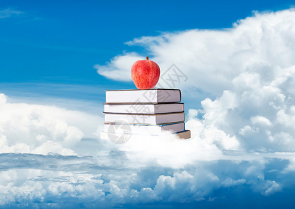 书上的苹果云端上有一堆书设计图片