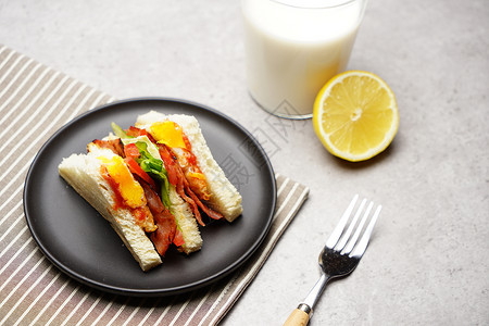 叉子餐具水果与三明治美食组合背景