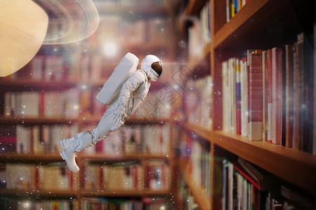 书中漫游的太空人高清图片