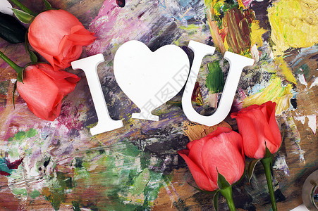 画板上我爱你和玫瑰鲜花背景图片