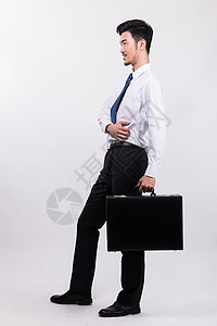 男人提着包穿衬衣提着公文包的商务人背景