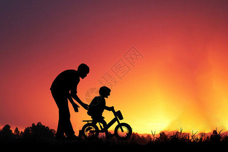 深情拥抱自行车上父子剪影设计图片