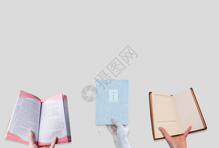 翻页的书手里拿着书创意背景图设计图片