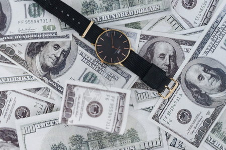 钱和时间美元和手表背景
