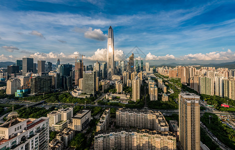 俯瞰树林与街道城市之巅背景