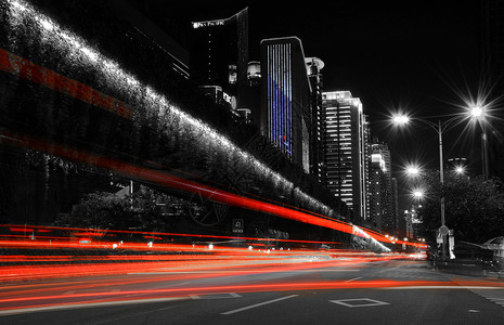 夜景朦胧厦门街道夜景车灯光影轨迹背景