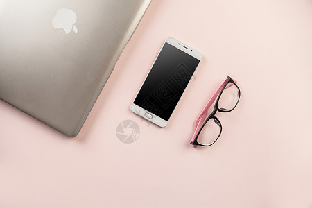 粉色金属手机数码产品和日常用品背景