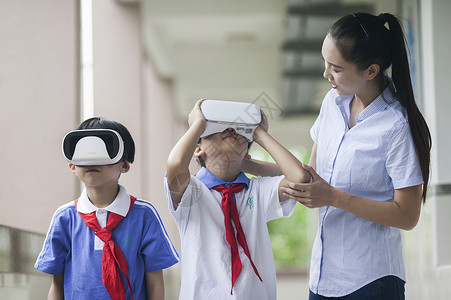 模拟教室女老师在学校给同学们使用vr进行远程教育背景