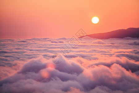 飞机夕阳夕阳晚霞时的云海背景