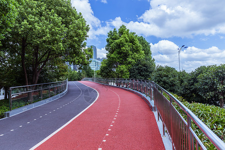 红色塑胶跑道阳光下公园设施塑胶路背景