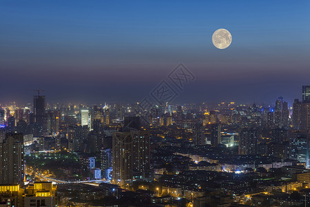 十五月亮城市上空的中秋月背景