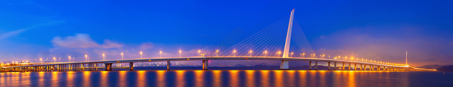 蓝黄配色跨海大桥城市夜景背景