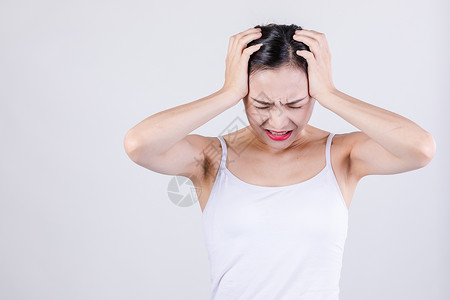 情绪女性棚拍居家女人表现头痛情绪背景