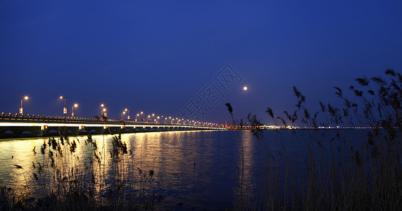 海上生明月夜景夜桥高清图片