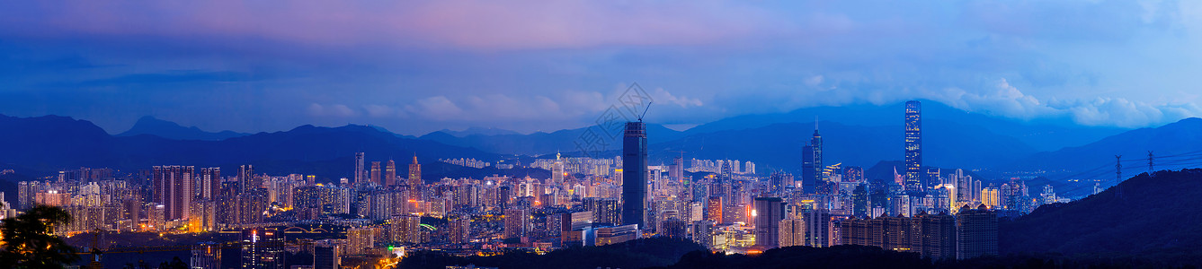 夜色中渐变华灯初上城市夜景背景