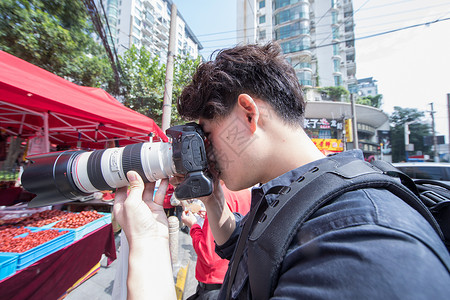 集市纪实摄影师用长焦扫街背景