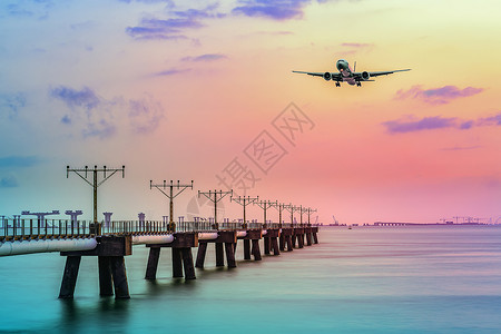 飞机分类素材香港海边夕阳飞机起飞背景