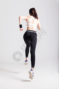 奔跑跑步的运动女性背影高清图片