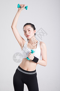 运动女性单手高低举哑铃动作背景图片
