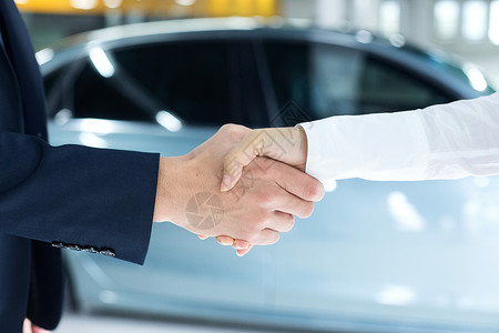 汽车销售成功握手背景图片