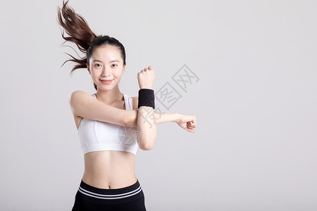舒展肢体年轻女子运动健身热身背景