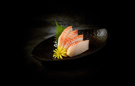 暗背景下的日式料理寿司刺身三文鱼高清图片素材