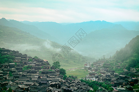 西江苗寨旅游胜地的古镇特色建筑风光炊烟高清图片素材