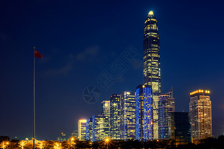 鹤立鸡群国旗与高楼大厦夜景背景