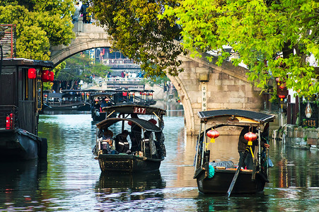 江南水乡西塘河流乌篷船背景图片