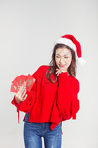圣诞节发红包的女性图片