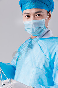戴口罩穿手术服的手术医生图片