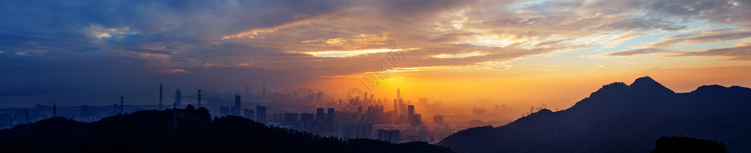 城市逆光城市海湾山脉夕阳背景