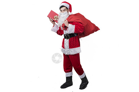 圣诞老人背礼物包裹高清图片