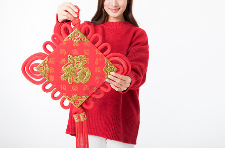 新年女性拿红色中国结背景图片